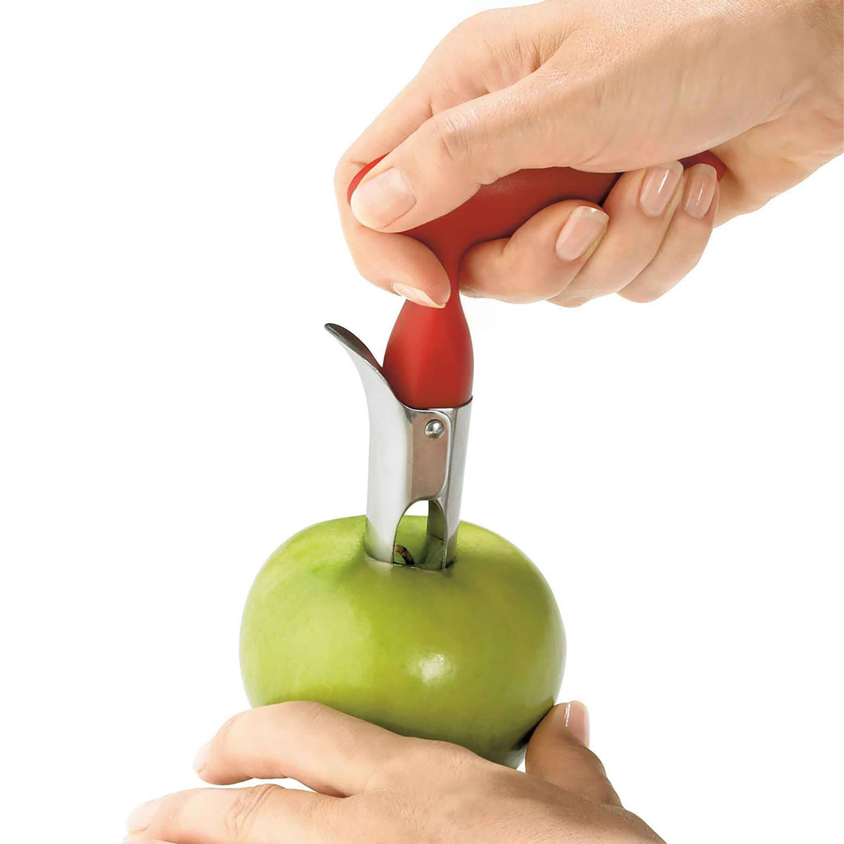 Red CUISIPRO apple core remover with a stainless steel blade and ergonomic handle for easy apple core removal.