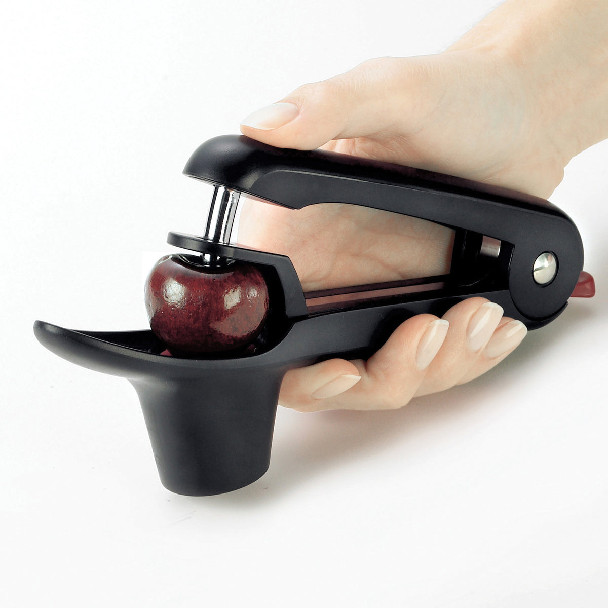 CUISIPRO cherry and olive pitter in black with ergonomic handle, designed for easy pitting of cherries and olives.
