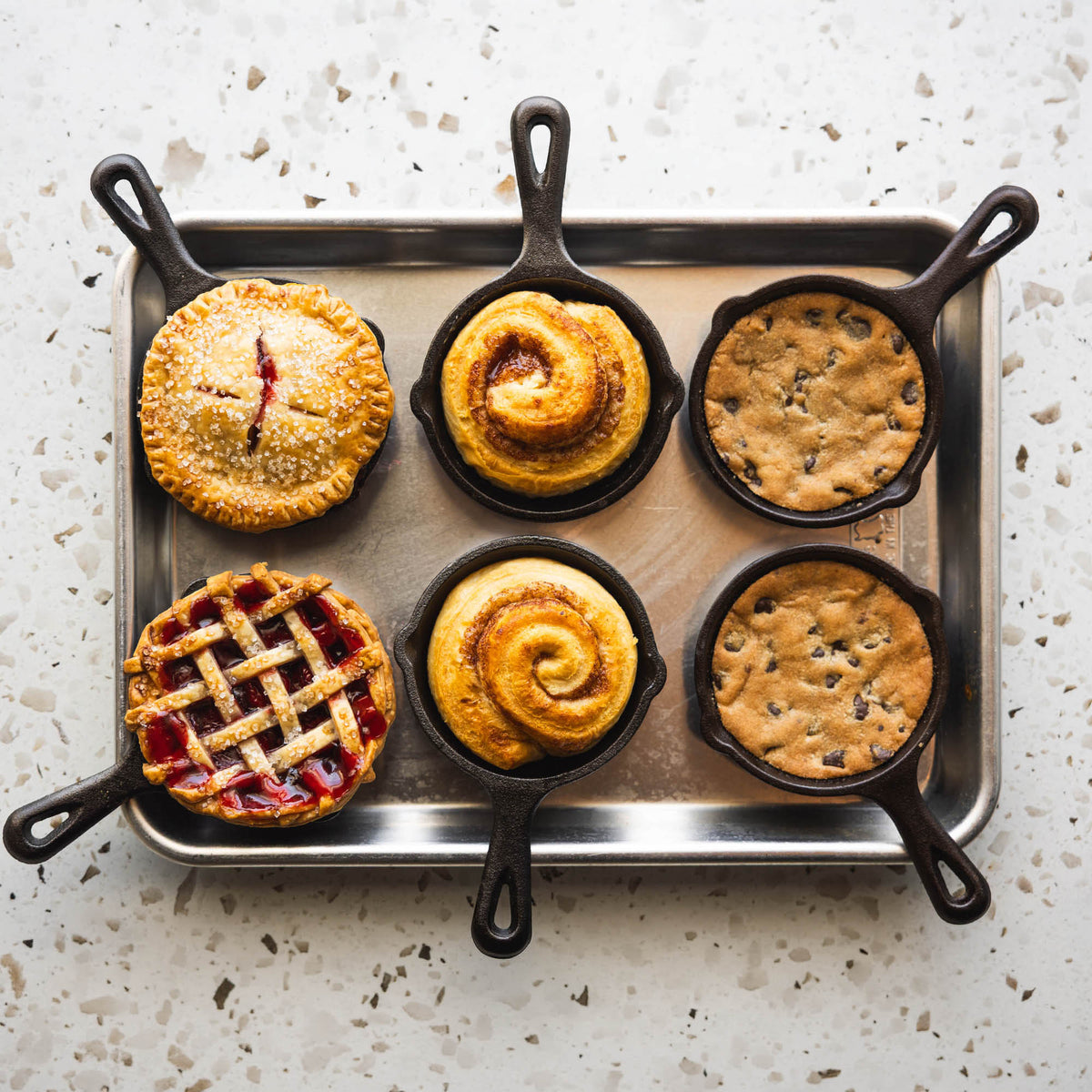Black Lodge Classic cast iron skillet with sturdy handle, perfect for cooking and frying on stovetops and in ovens.