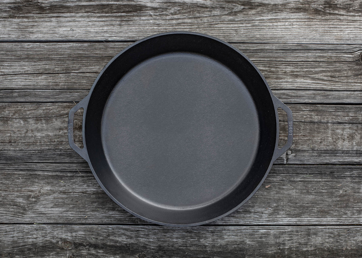 Lodge classic black cast iron skillet showing smooth cooking surface and sturdy handle for versatile stovetop cooking.