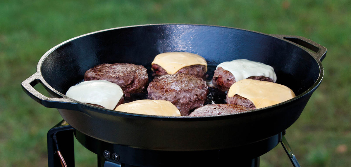 Lodge classic black cast iron skillet with handle, ideal for frying, searing, and versatile cooking.
