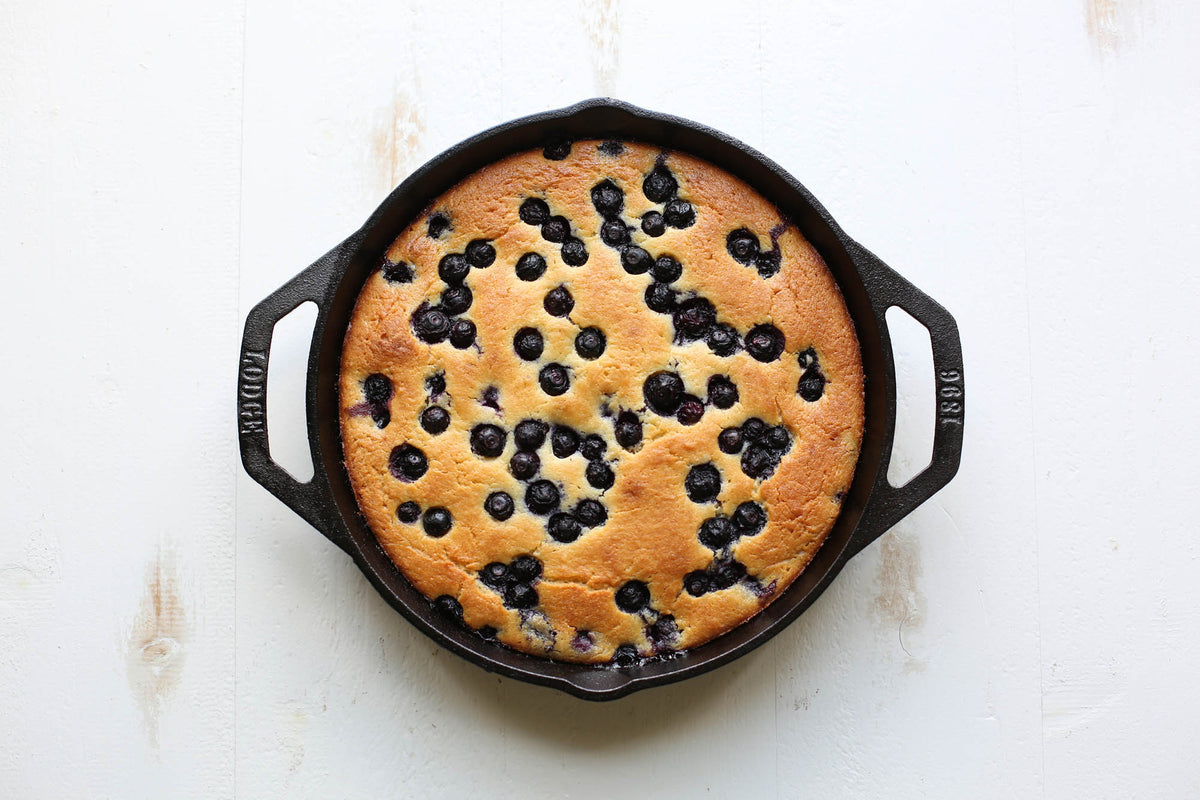 Lodge Classic black cast iron skillet with handle, ideal for cooking and frying in durable, seasoned cookware.
