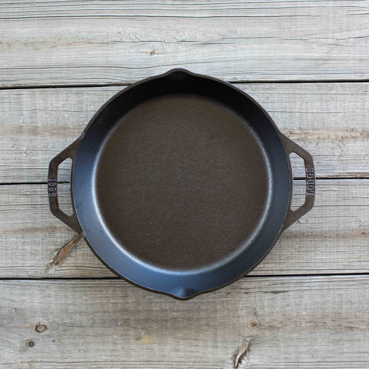 Lodge Classic black cast iron skillet showing smooth cooking surface and sturdy handle for versatile kitchen use.