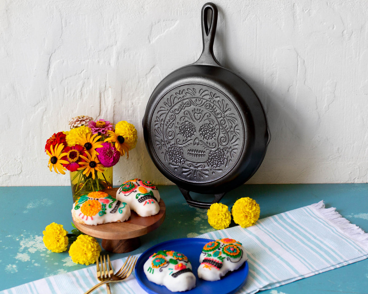 Lodge Classic black cast iron skillet frying pan with handle, durable and versatile for cooking on stovetop or oven.
