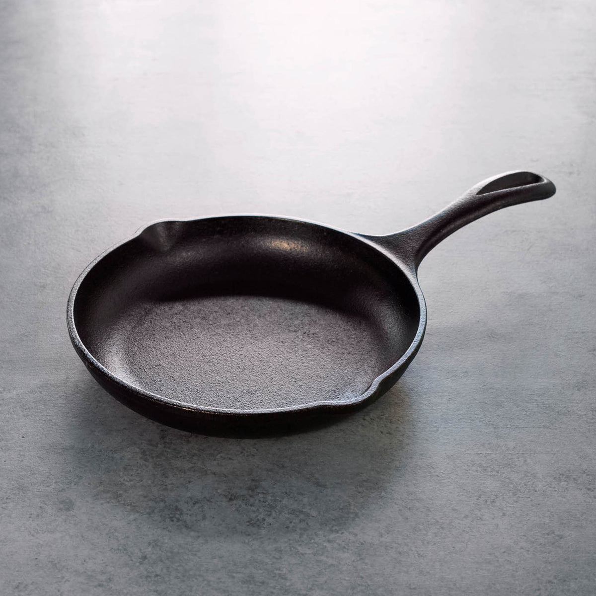 Black Lodge Chef cast iron skillet, heavy-duty frying pan with a smooth cooking surface and sturdy handle for versatile cooking.