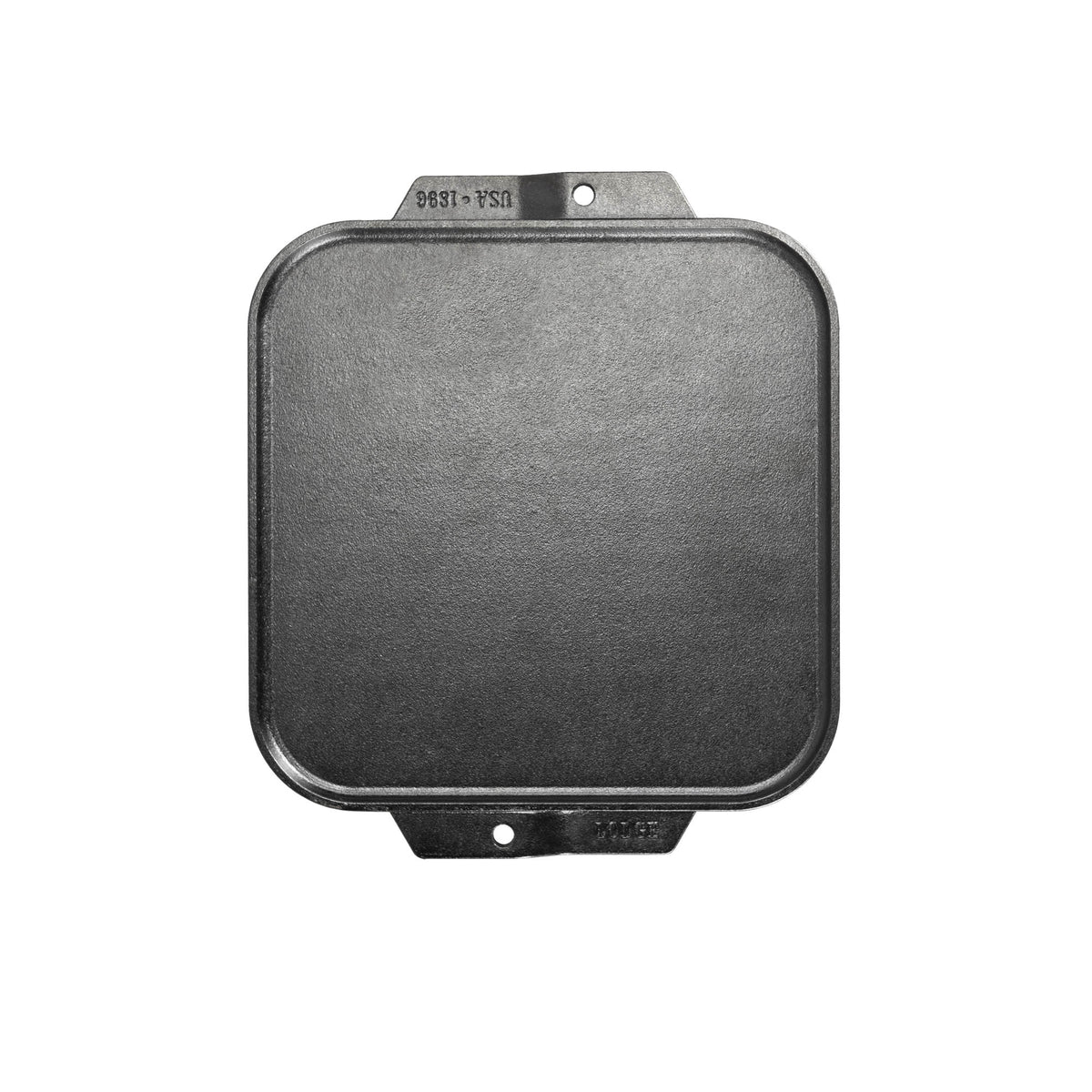 Lodge Classic black double-sided flat and ridged grill plate for versatile outdoor cooking or grilling.