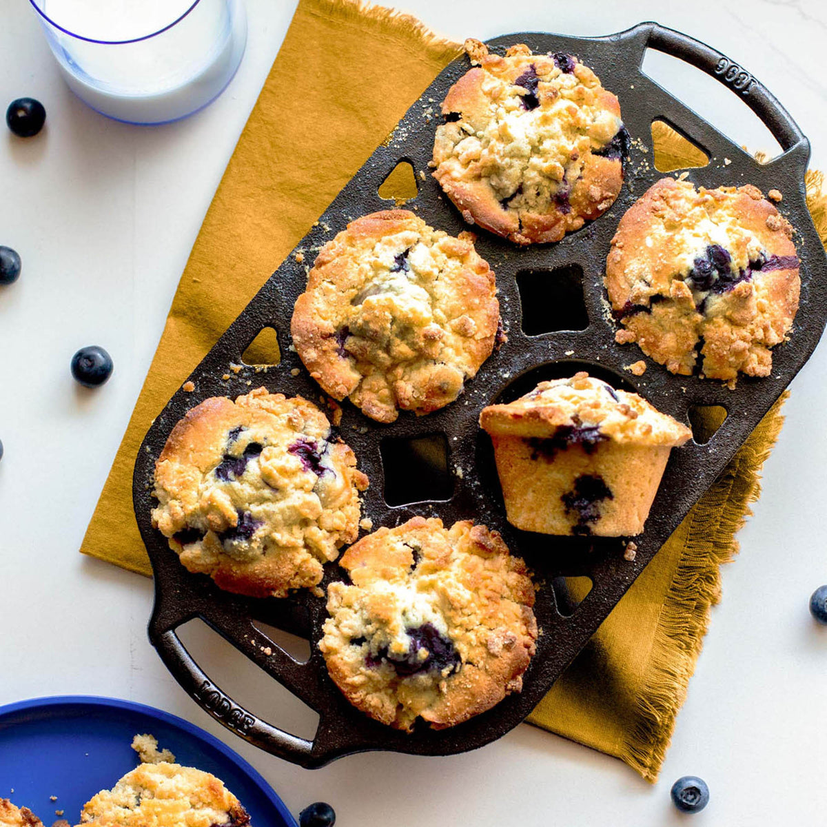Lodge classic black muffin tin with six cups for baking muffins and cupcakes, made of durable metal.