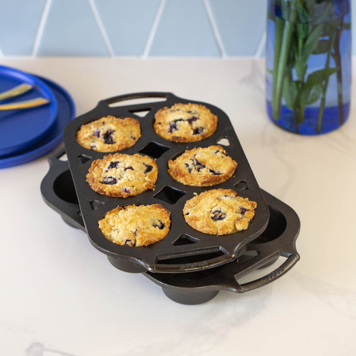 Lodge classic black muffin tin with six cups, made of durable metal for baking muffins and cupcakes.