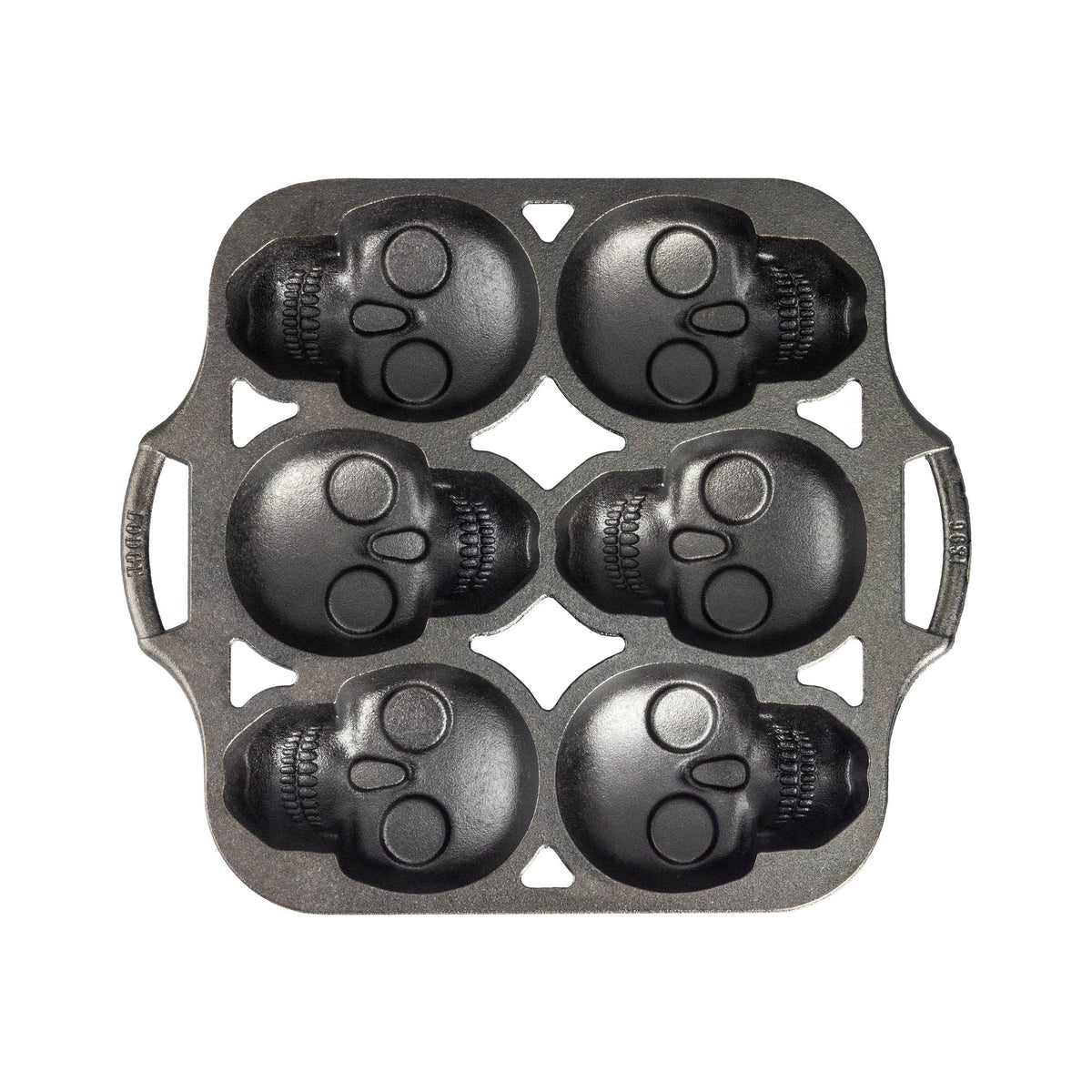 Lodge classic black cake pan with six skull-shaped molds, ideal for creative baking and themed cake designs.