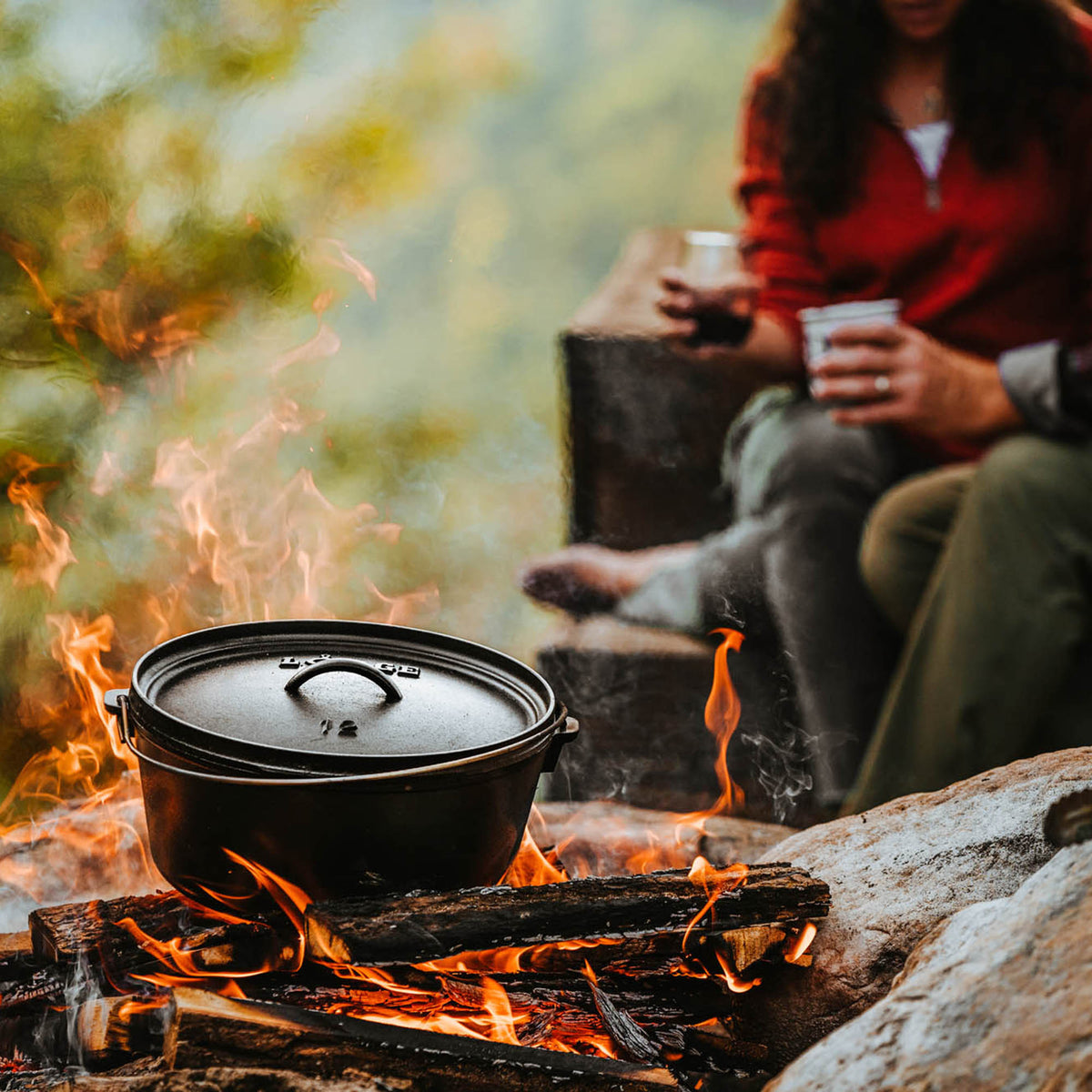 Lodge Classic black grill with a sturdy metal frame and cooking surface, designed for outdoor grilling and barbecues.