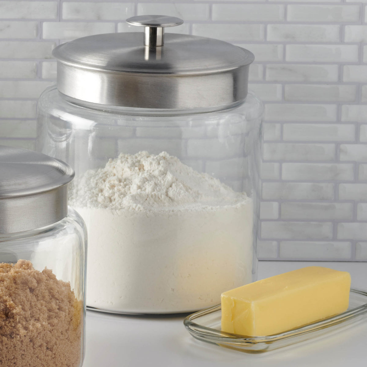 Anchor Hocking Montana storage jar with clear glass body and airtight lid, ideal for kitchen pantry organization.