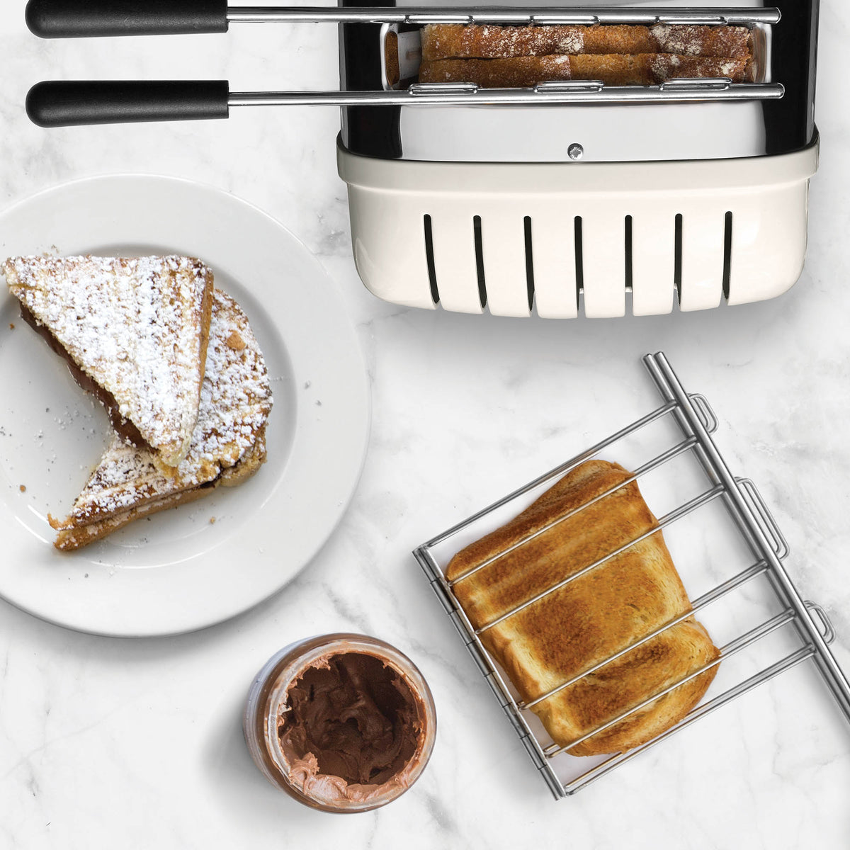 Dualit Classic stainless steel sandwich maker with non-stick plates and compact design, ideal for quick breakfast sandwiches.