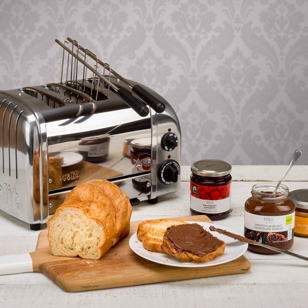 Dualit Classic stainless steel sandwichmaker with closed lid, non-stick plates, and cord storage for easy use.