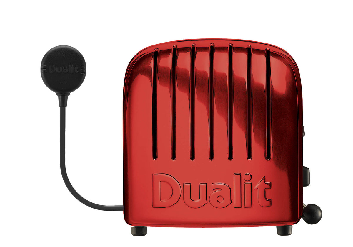 Dualit NewGen toaster with red finish, two-slot design, modern style, and control dial for perfect toast.