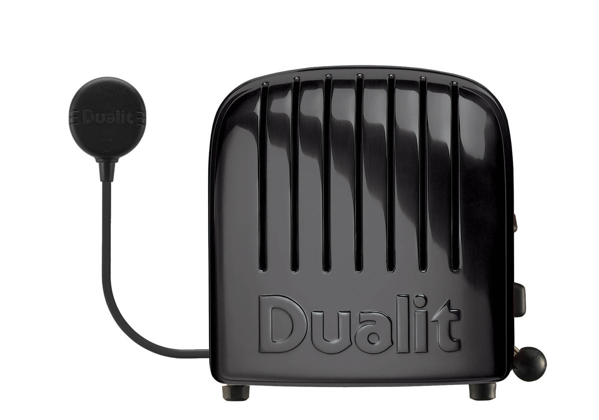 Dualit Toaster NewGen in black with four slots, sleek modern design for toasting bread and bagels.
