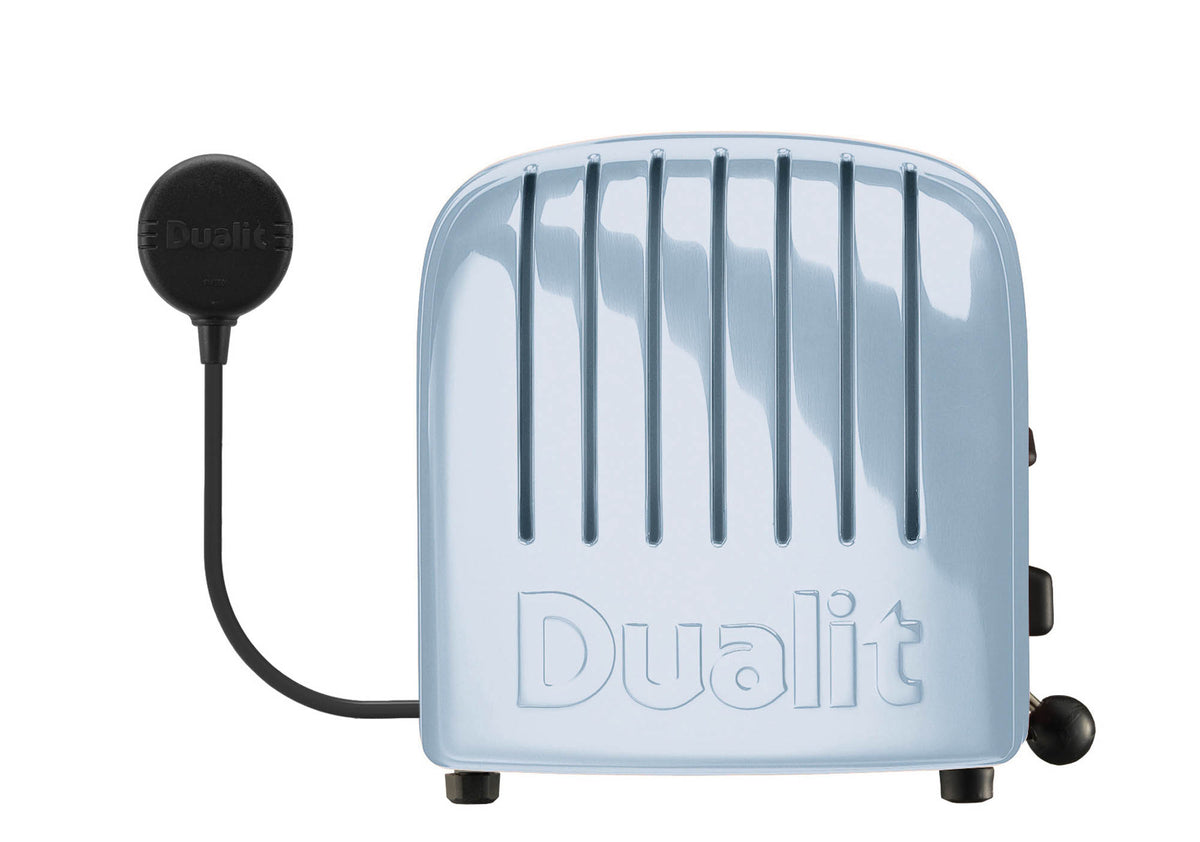 Dualit NewGen blue 4-slice toaster with modern design and control buttons, shown with toast slots open.