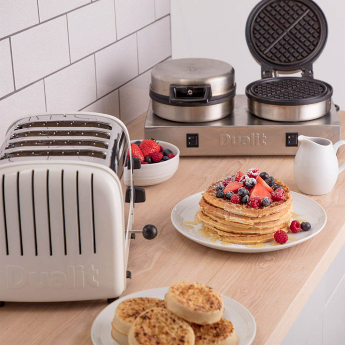 Polished DUALIT contact toast and waffle iron for catering, shown with its stainless steel surface and cooking plates.