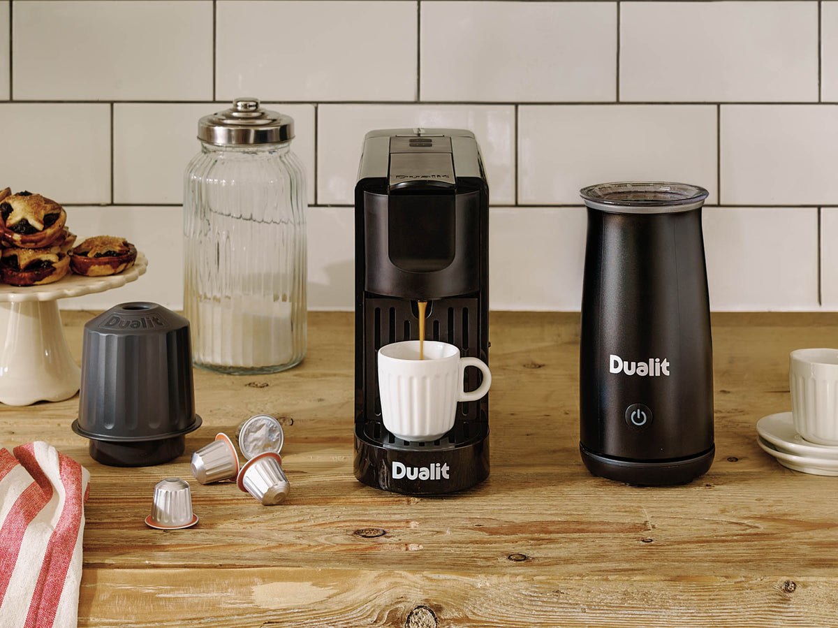 Dualit coffee capsule machine in black, 34 cm tall, compact and modern design for easy use and stylish kitchen setup.