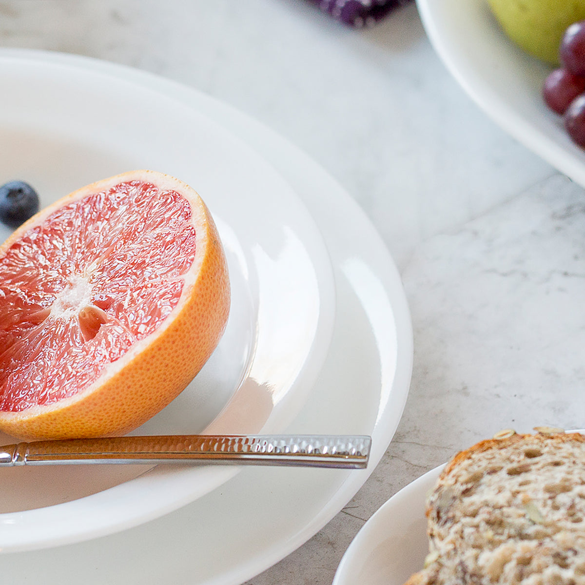 Corelle Winter Frost white dinnerware set featuring elegant, durable ceramic plates and bowls with a frosty winter design.