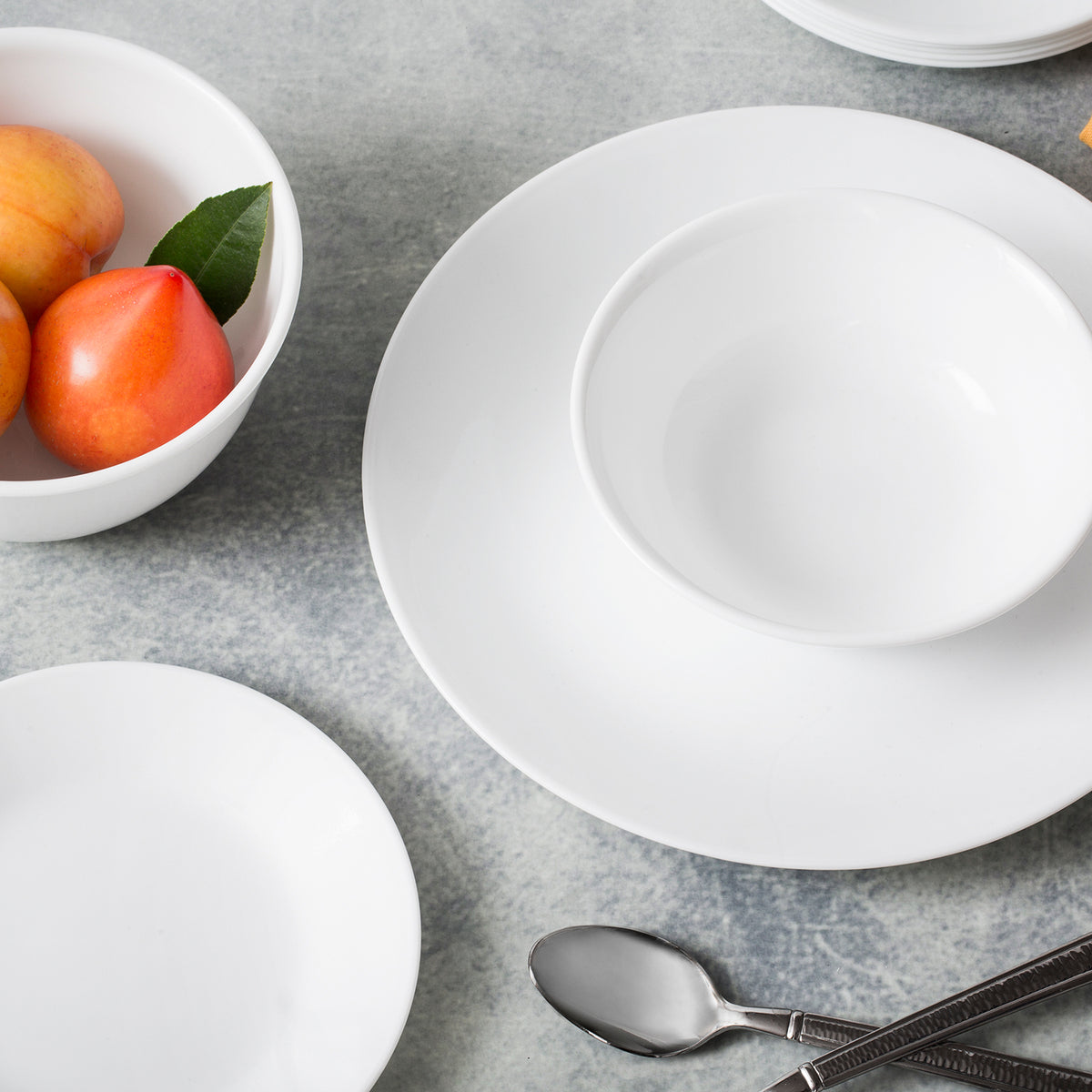 Corelle Winter Frost white dinnerware set with plates and bowls, durable ceramic dishware for everyday use.