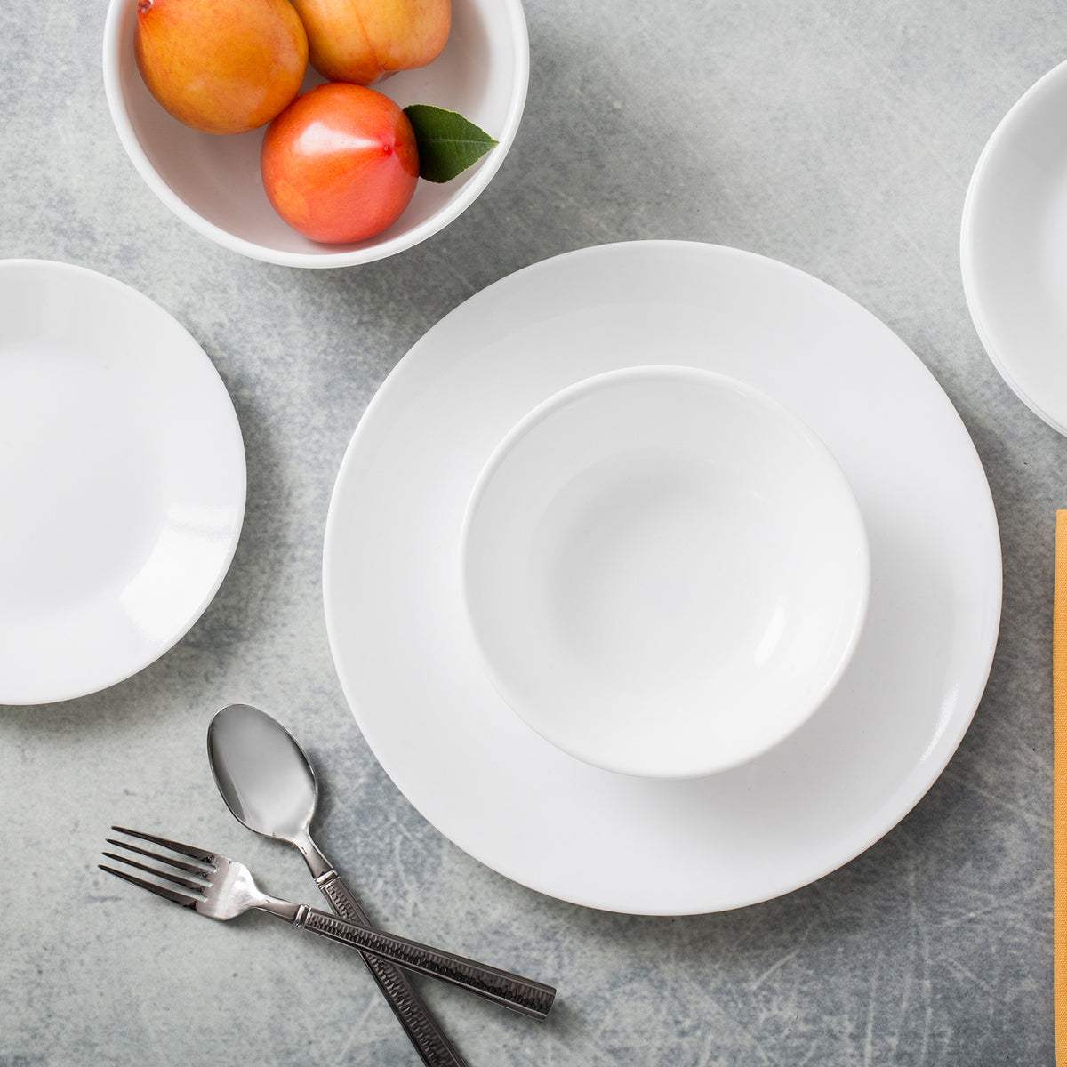 Corelle Winter Frost white dishware set featuring elegant, snowflake-inspired design on porcelain dinnerware.