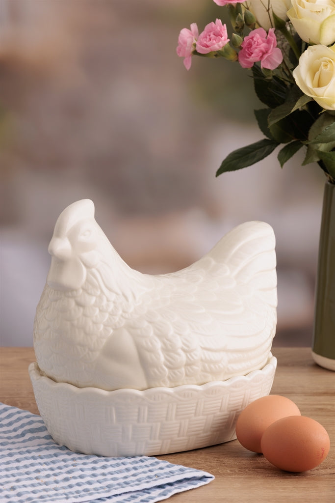 White ceramic hen figurine from Mason Cash, detailed with textured feathers and a realistic appearance.