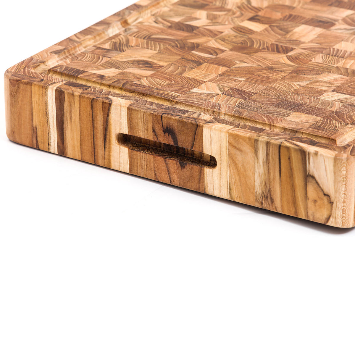 Teakhaus butcher block cutting board made of teakwood, rectangular with smooth surface and sturdy construction for kitchen use.