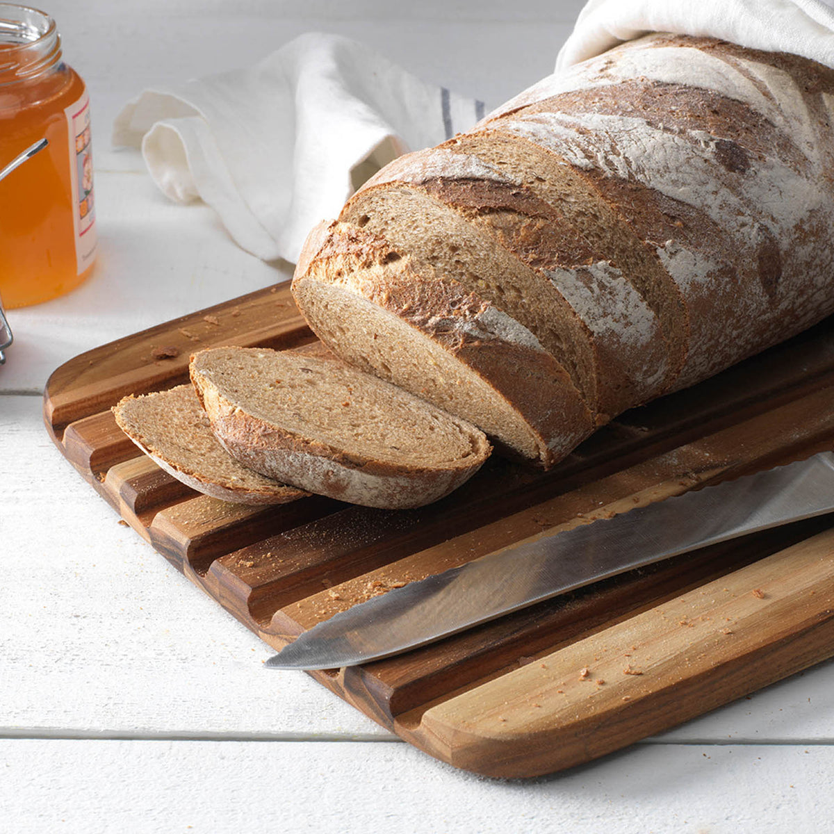 Teakhaus teak wood cutting board, ESSENTIAL series, natural teak finish, rectangular shape with smooth edges for kitchen prep.