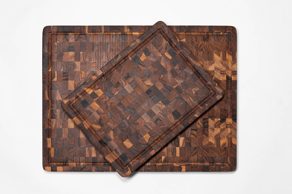 Teakhaus teak wood butcher block cutting board with smooth surface and sturdy construction for kitchen use.