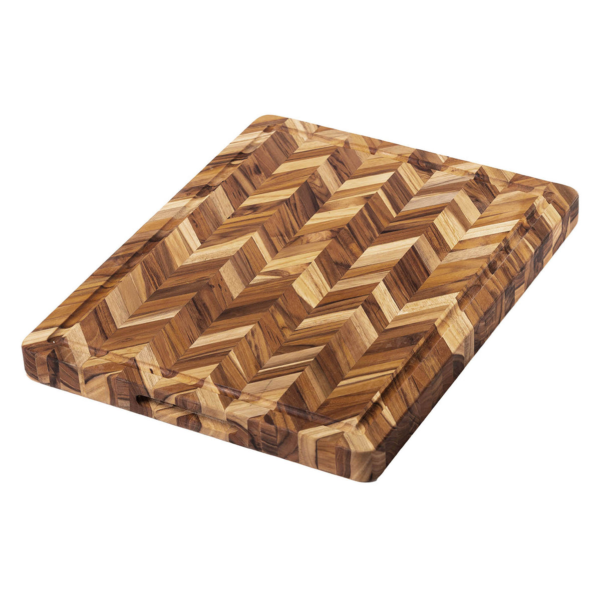Teakhaus teak wood cutting board with herringbone pattern, used for chopping and serving food in a natural kitchen setting