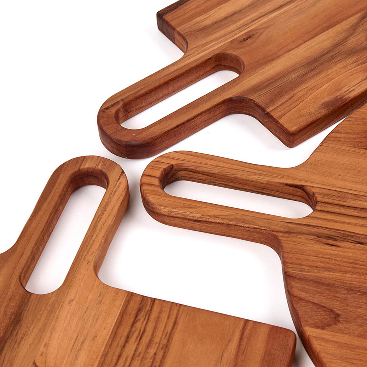 Teakhaus teak cutting board with a natural wood finish, ideal for kitchen prep and serving, made from durable teak wood.