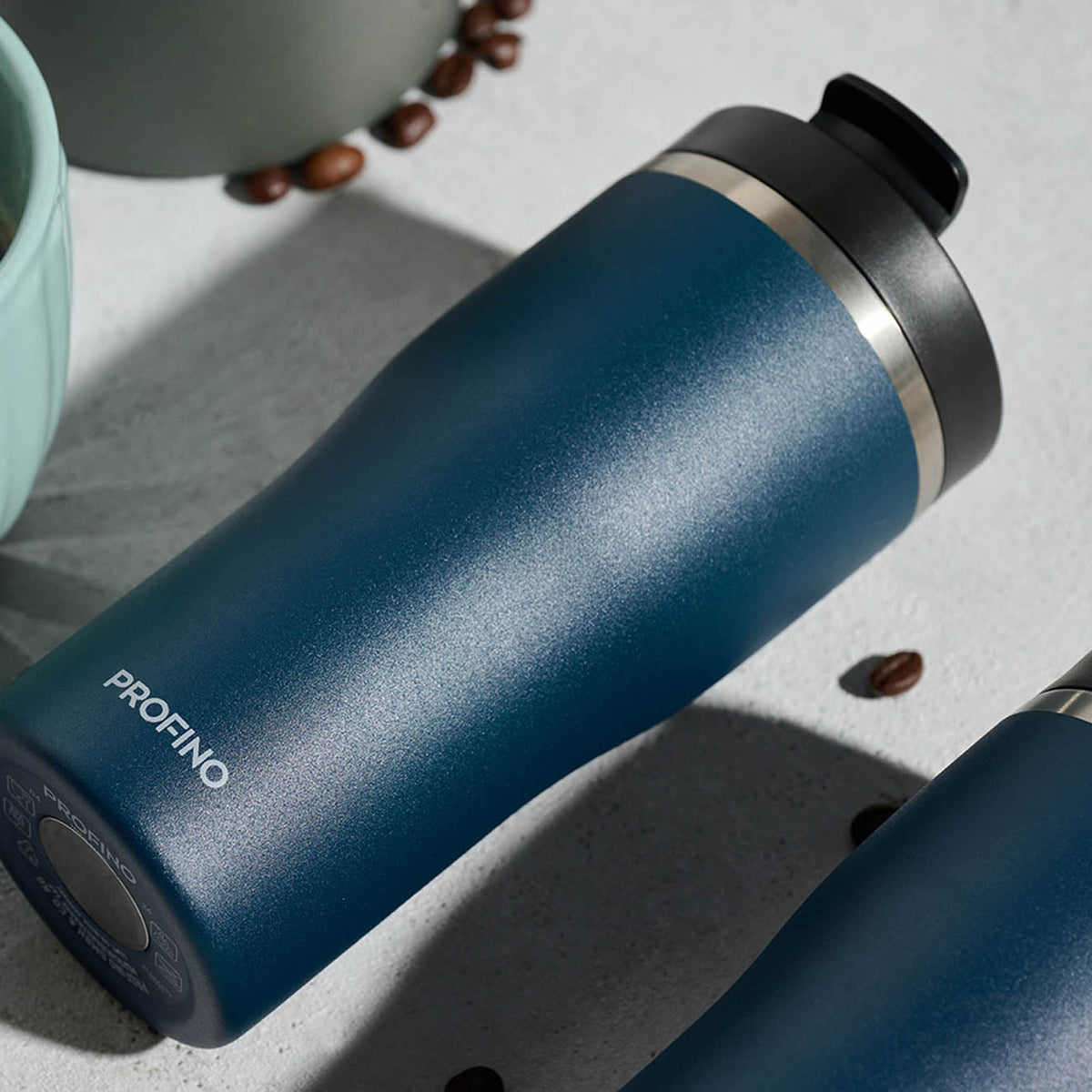 Blue PROFINO Barista thermobecher with stainless steel body and black lid, designed for keeping beverages hot or cold.