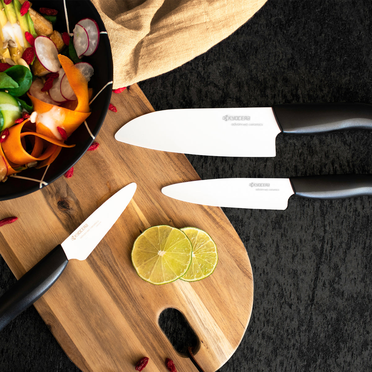 KYOCERA black ceramic knife with a sleek handle, ideal for precise slicing and cutting in the kitchen.