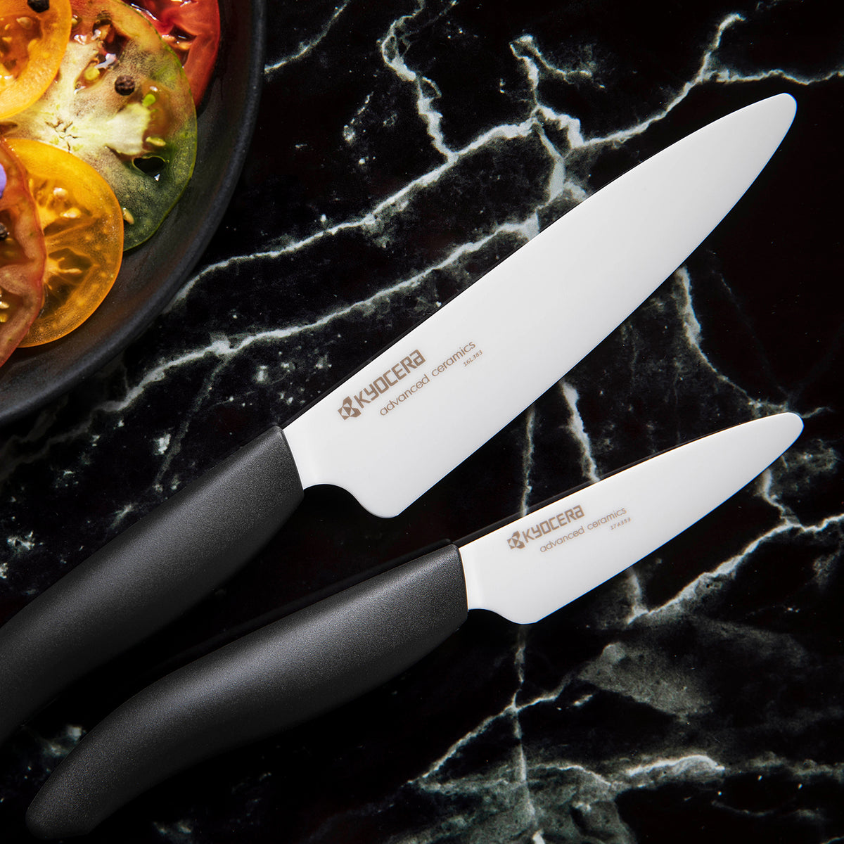 KYOCERA black ceramic kitchen knife with a sleek handle, designed for precision cutting and durability.
