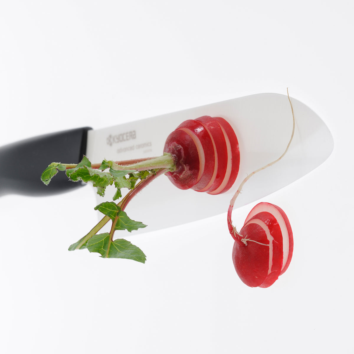 KYOCERA black ceramic knife with a sleek handle, designed for precision cutting and durability in kitchen use.