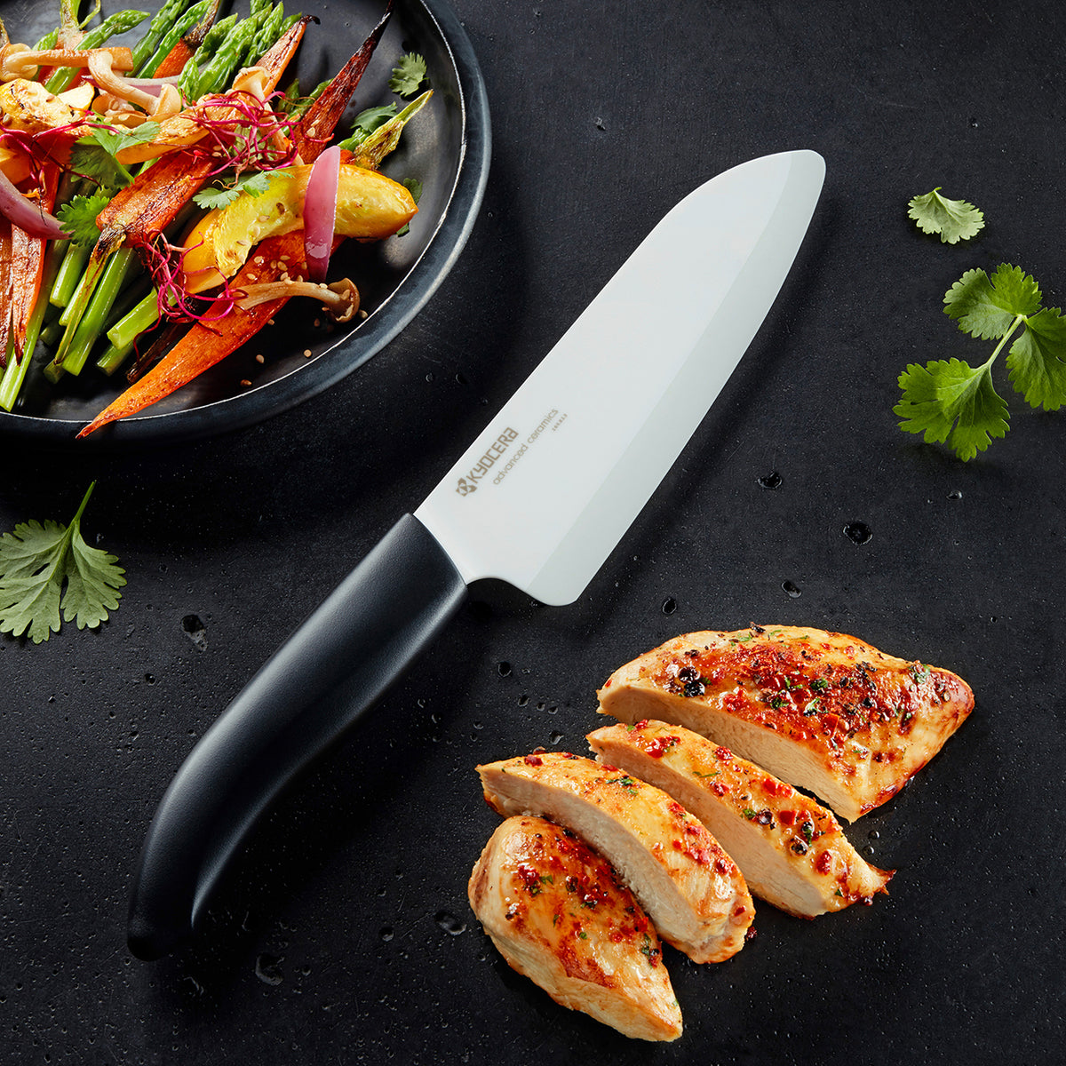 KYOCERA black ceramic knife with sleek handle, ideal for precise cutting and slicing in the kitchen.