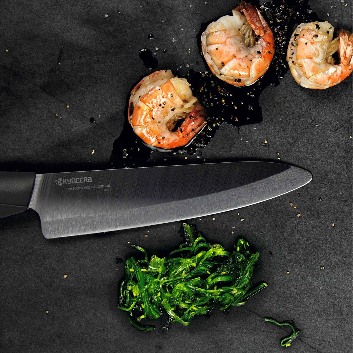 KYOCERA black ceramic knife with sleek handle, ideal for precise slicing and kitchen prep.