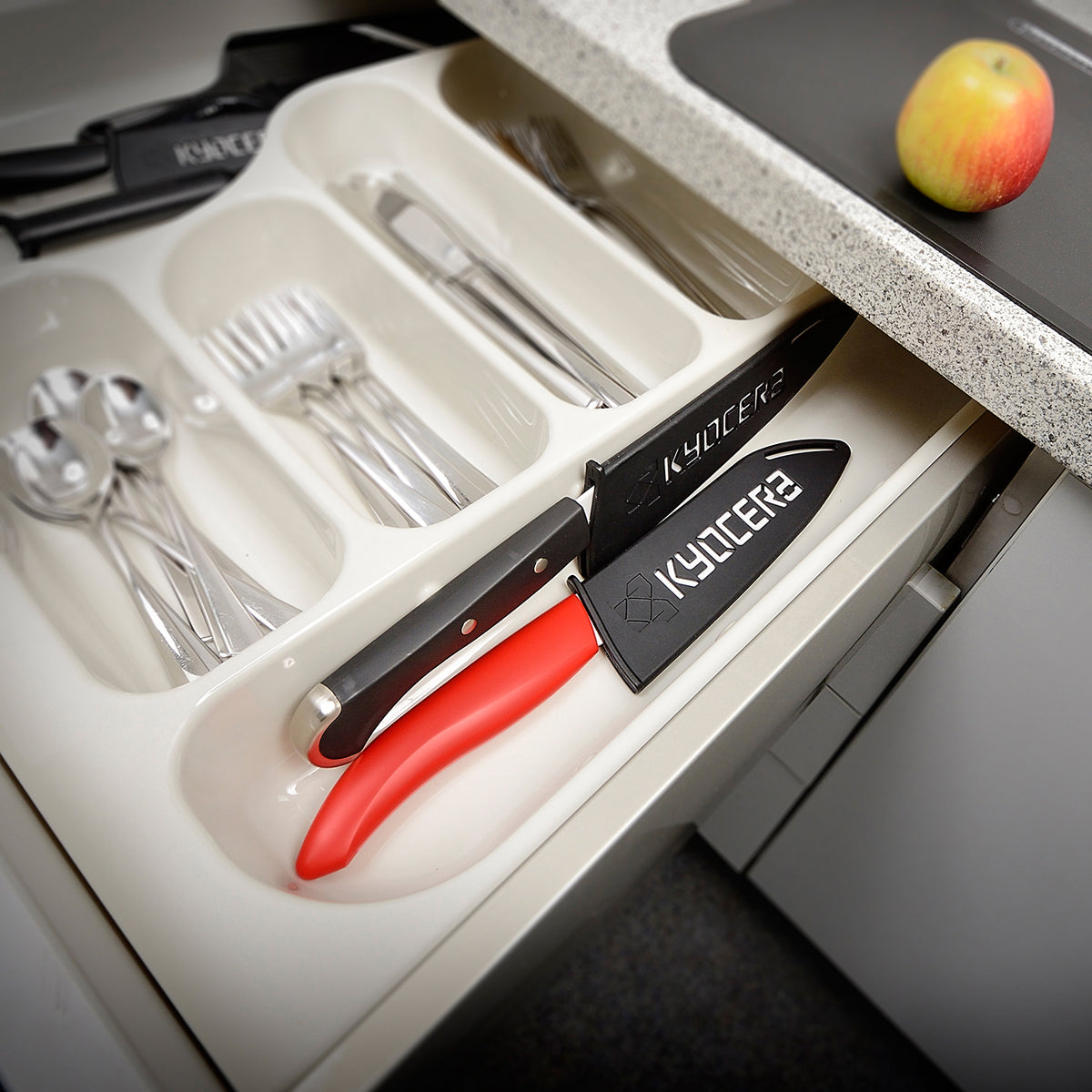 Black KYOCERA knife guard for blades up to 11 cm, protective knife cover for safe storage and handling.
