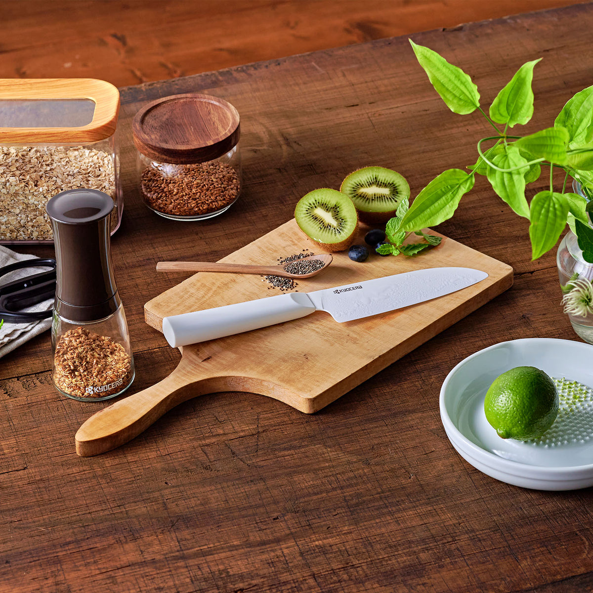 KYOCERA white ceramic kitchen knife with a sleek handle, perfect for precise cutting and slicing.