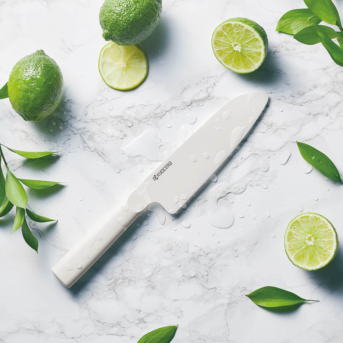 KYOCERA white ceramic kitchen knife with a sleek blade and ergonomic handle for precise slicing and cutting.