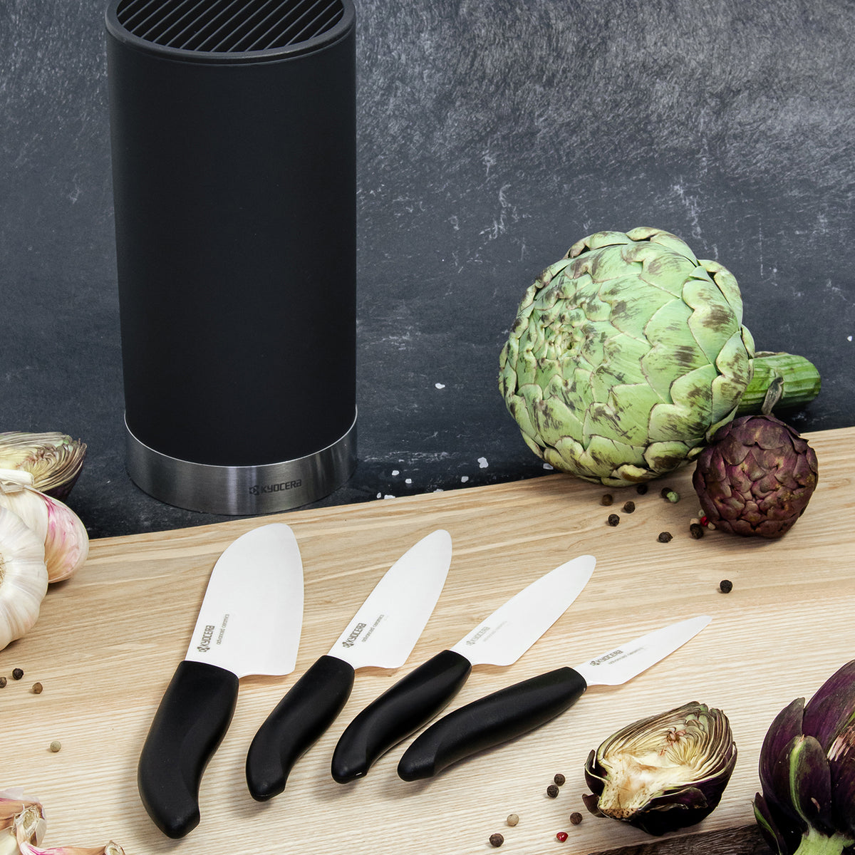 KYOCERA knife block with four GEN soft-touch knives, sleek black design for safe and easy kitchen use