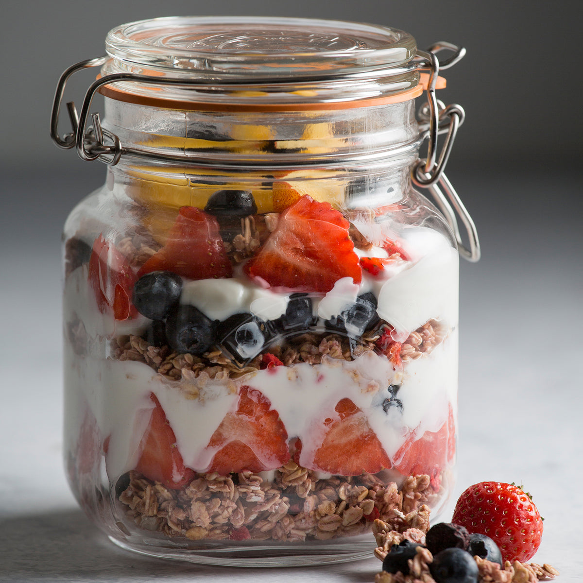 KILNER Clip Square glass jar for canning, clear with metal clip lid, suitable for preserving foods and storage.