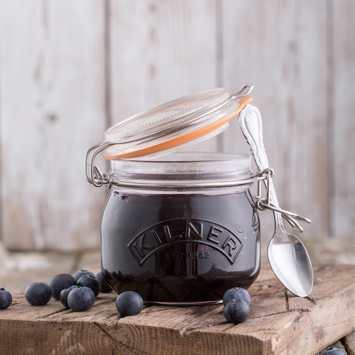 Clear KILNER clip round canning jar for preserving food, with a secure metal clip lid and transparent glass body.