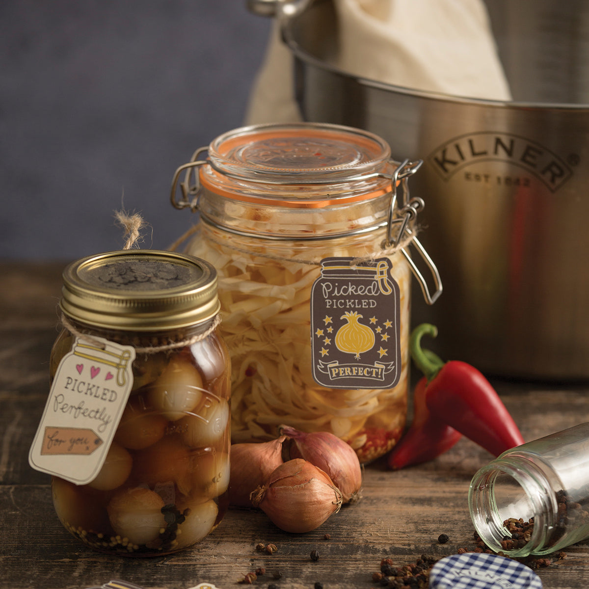 KILNER Clip Round clear glass jar for canning and preservation, with a metal clip lid, ideal for storing food.