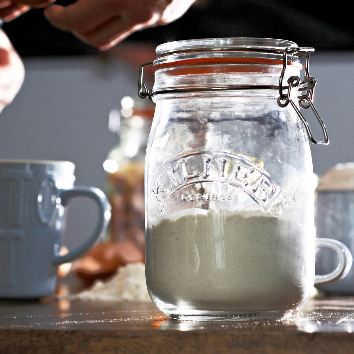 KILNER clear round canning jar with metal clip lid, glass preservation container for homemade jams and preserves.