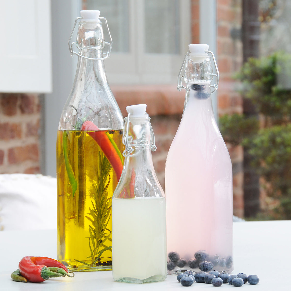Clear KILNER Clip Square canning jar with metal lid for preserving and storing homemade preserves or liquids.