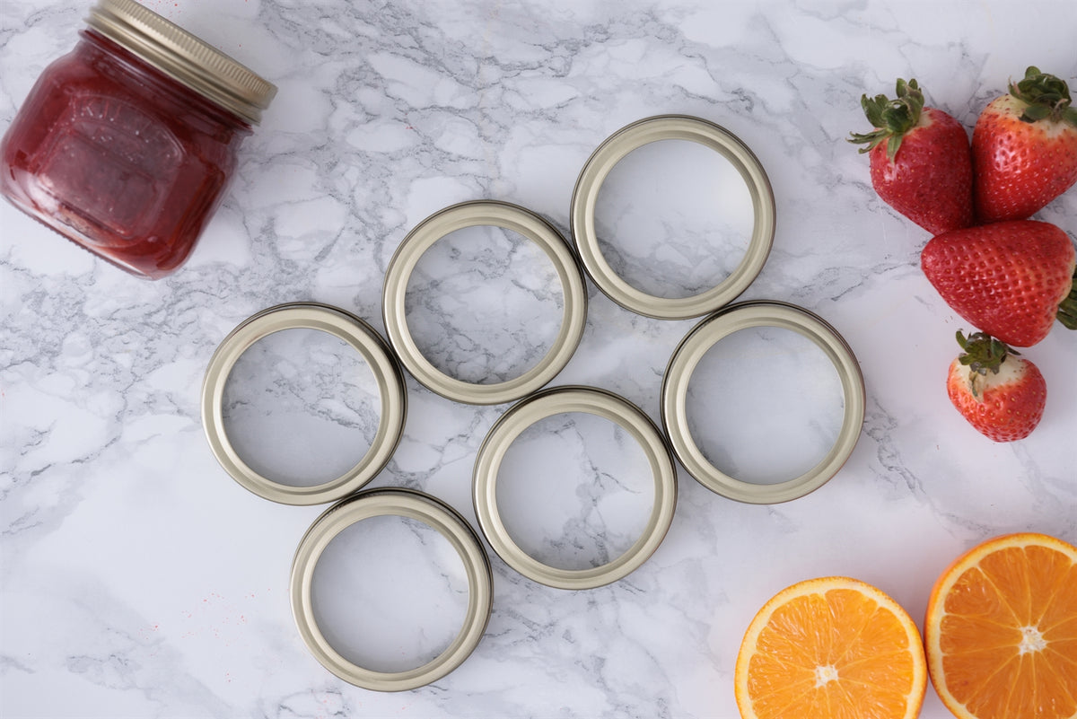 Set of six KILNER metal canning lids for jars, ideal for preserving and sealing homemade jams and preserves.
