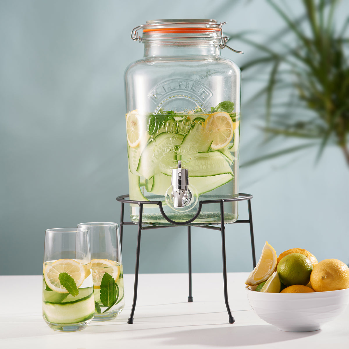Clear KILNER 5L round beverage dispenser with spigot for easy serving of drinks at parties or gatherings.