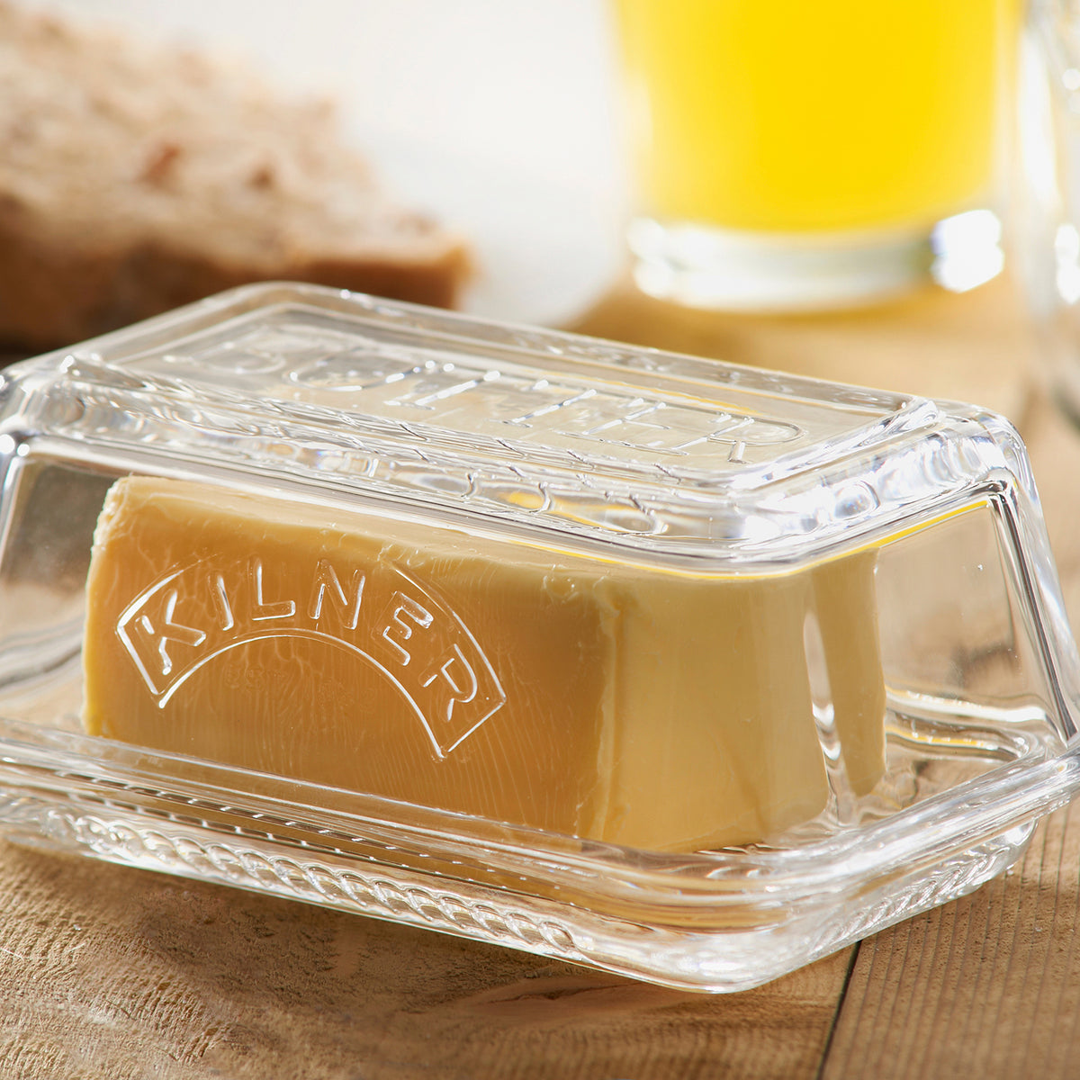 KILNER Butterglocke clear glass butter keeper with 250g capacity, featuring a lid and butter inside for serving and storage.