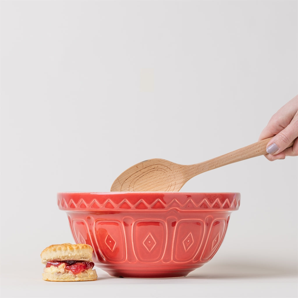 Red Mason Cash mixing bowl with a smooth, rounded design, ideal for baking and food preparation on a kitchen countertop.